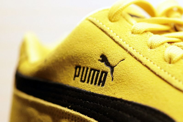 Un logo Puma est visible sur une basket Puma Speedcat OG